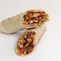 Chicken Shawarma Wrap · Tortilla, tomatoes, pickles, and onions. Includes garlic sauce. Served with hummus & pita ch...