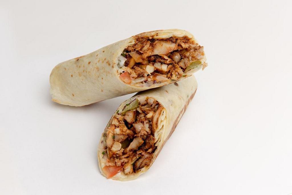 Chicken Shawarma Wrap · Tortilla, tomatoes, pickles, and onions. Includes garlic sauce. Served with hummus & pita chips or seasoned fries.