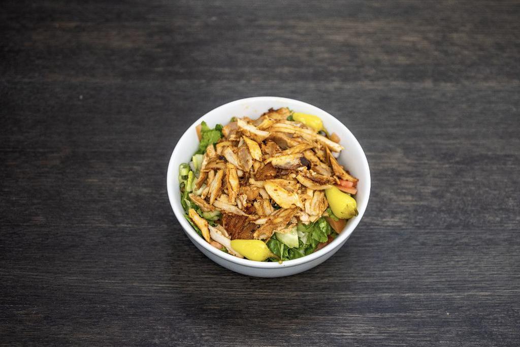 Chicken Shawarma Salad Bowl · Mixed greens, tomatoes, cucumbers, onions. Served with balsamic vinaigrette and garlic sauce.