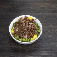 Beef Shawarma Salad Bowl · Mixed greens, tomatoes, cucumbers, onions. Served with balsamic vinaigrette and tahini sauce.