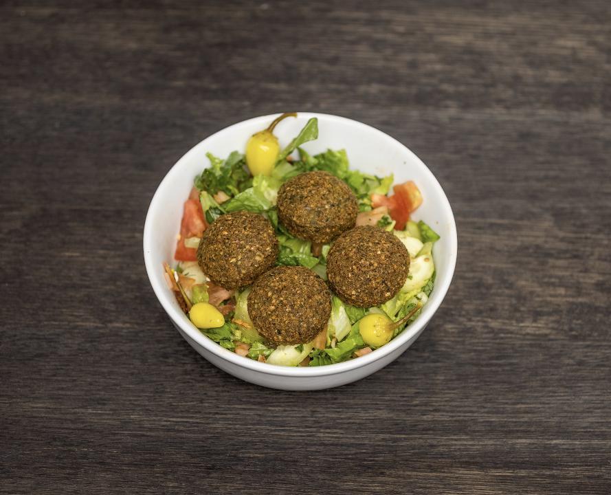 Falafel Salad Bowl · Mixed greens, tomatoes, cucumbers, onions. Served with balsamic vinaigrette and tahini sauce.