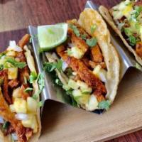 Fish Tacos · Three soft tacos, white fish, tomato, serrano chile, onion & cilantro. Served with rice & re...