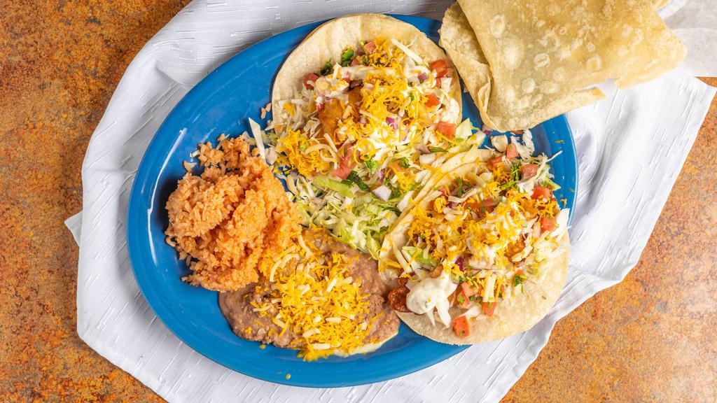 Tacos De Camarón · Pescado · Your choice of two prepared Ensenada-style. Soft corn tortillas filled with pico de gallo and fresh cabbage, topped with our special white sauce.