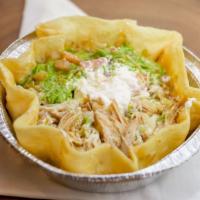 Taco Salad · Crispy tortilla shell filled with rice, beans, lettuce, and your choice of chicken, carnitas...