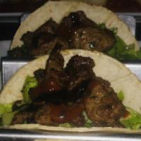 Korean Steak Tacos · Tender New York steak, marinated Korean style.