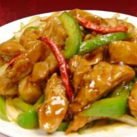 Szechuan Chicken · Stir-fried chicken with bell peppers and yellow onions in a savory and spicy sauce.