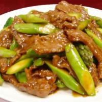 Asparagus Beef · Stir-fried beef with asparagus in a savory black bean sauce.