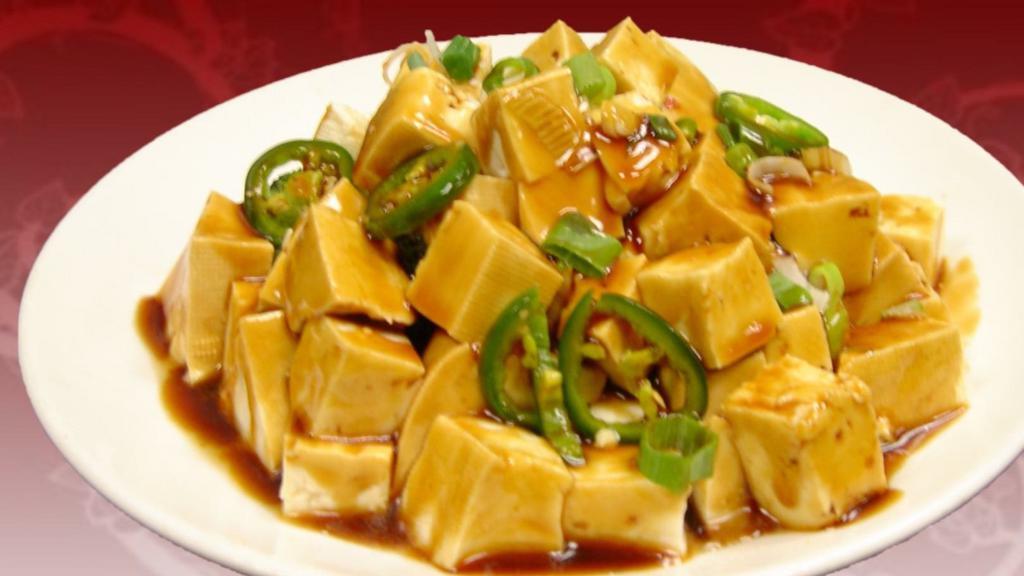 Szechuan Style Tofu · Stir-fried tofu with a spicy and savory sauce topped with jalapeños.