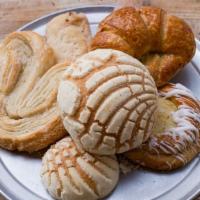 Pan Dulce By The Dozen - Assorted · Four mini conchas, two pan finos, two cinnamon roll, two taquitos, two cuernitos plain. Asso...