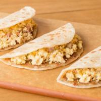 Breakfast Taco Trio · Huevo ranchero on our scratch-made Sonora flour tortilla! Serving of three tacos.