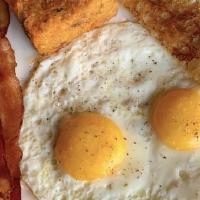 Two Egg Bacon + Sausage Plate · 2 Eggs Any Style, Tater Tots, Applewood Bacon + Home-Made Sausage, and Your Choice of Any To...