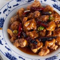 Orange Chicken · Chicken chunks with dried orange peel and hot pepper in a sweet hot sauce. served with white...