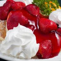 Strawberry Pancakes · Topped with fresh, sweet strawberries in a compote and real whipped cream.  Dusted in powder...