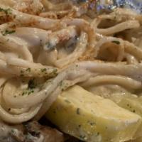 Rasta Pasta · Seasoned pasta with sautéed mushrooms ,peppers and seasonal veggies in a garlic cream sauce ...