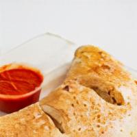 Vegetarian Calzone · Bell peppers, black olives, mushrooms, red onions, tomato sauce.