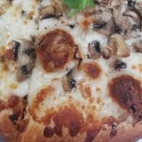 Truffle Mushroom Pizza · Truffle garlic aioli sauce, parmesan cheese, mushroom and arugula