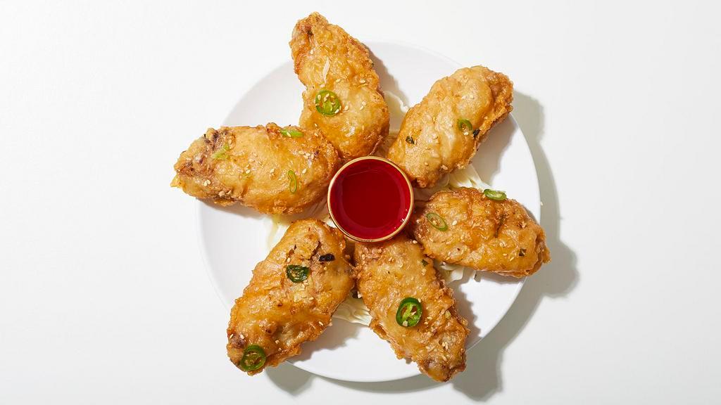 Salt And Pepper Chicken Wings · Chicken wings fried and seasoned with salt and pepper.
