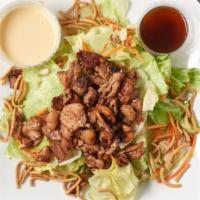 Teriyaki Chicken Salad · Grilled teriyaki chicken, silvered almonds, crunchy noodles, shredded carrots and lettuce wi...