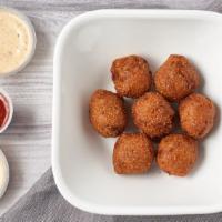 Hushpuppies (6 Pc) · Served with ranch.