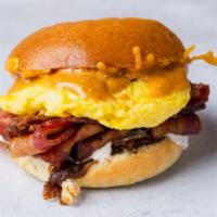 Birdies Breakfast Sandwich With Eggs And Bacon · Over easy or scrambled egg with Applewood smoked bacon and cheddar with Birdies' special sau...