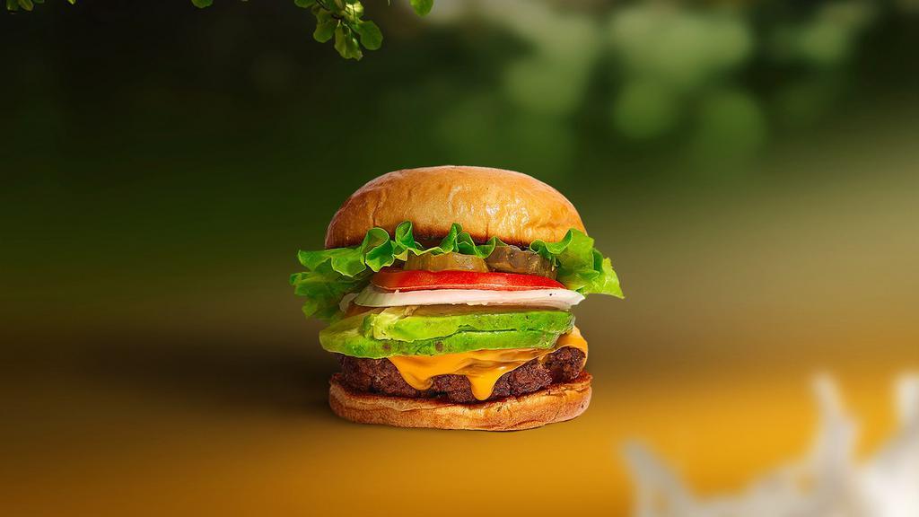 Guac The Streets Burger · Seasoned Beyond meat patty topped with avocado, melted vegan cheese, lettuce, tomato, onion, and pickles. Served on a bun.
