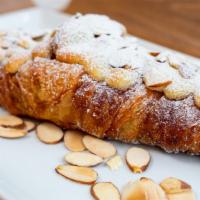 Almond Croissant · Almond cream filled buttery croissant, topped with almond flakes!
