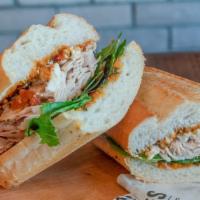 The Belmont · Grilled chicken breast, goat cheese, sun-dried tomato pesto, mixed greens on french roll.