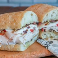 The Broadway Sandwich · Boars head turkey breast, gioia fresh mozzarella, house-made roasted red peppers, homemade o...