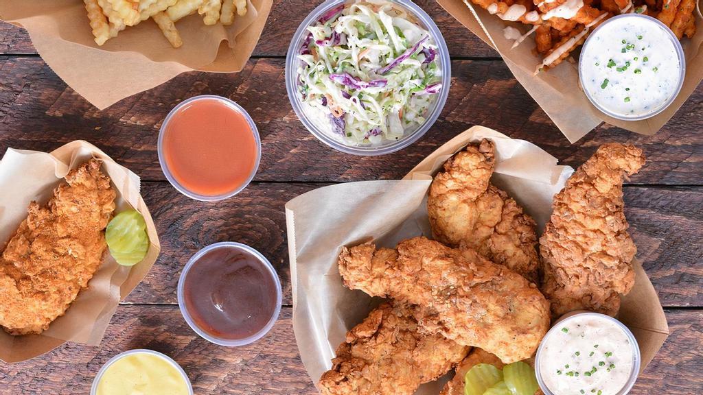 18 Tendies Tenders Party Box (6-8 People) · 18 pieces of Tendies’ famous jumbo, buttermilk herb marinated, double hand-breaded chicken tenders with tangy coleslaw, fries, pickles and choice of sauces and seasoning.