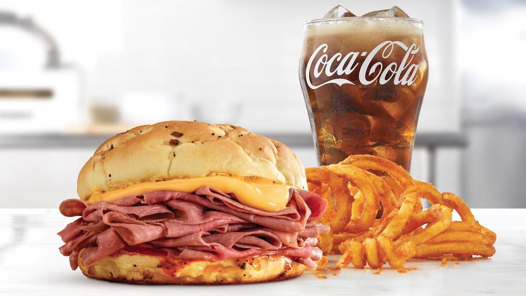 Beef 'N Cheddar Double Meal · Two times the amount of thinly sliced roast beef than the Classic, with cheddar cheese sauce and zesty red ranch sauce on a toasted onion roll.  Visit arbys.com for nutritional and allergen information.