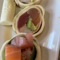 Sashimi Roll · Tuna, salmon, albacore, crab, avocado, wrapped in cucumber w/ ponzu.