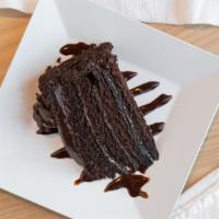 Chocolate Cake · Freshly-baked chocolate cake drizzled with creamy chocolate.