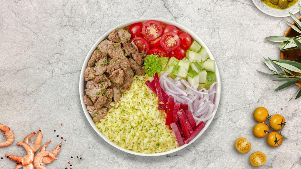 Beef Shawarma Plate · Beef shawarma plate. Comes with grilled tomato, spicy pepper, salad, rice, choice of side of hummus or baba ganoush, a choice of dipping sauce, and special home made bread. Sauce will be on the top(tahini). If you like sauce to be on the side, please let us know!
