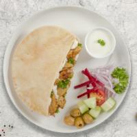 Chicken Shawarma Wrap · Hummus, lettuce, tomato, onion, and Tahini (white sauce).