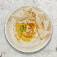 Hummus Plate · A mixture of mashed garbanzo beans, lemon juice and tahini, and garlic served with pita chips.