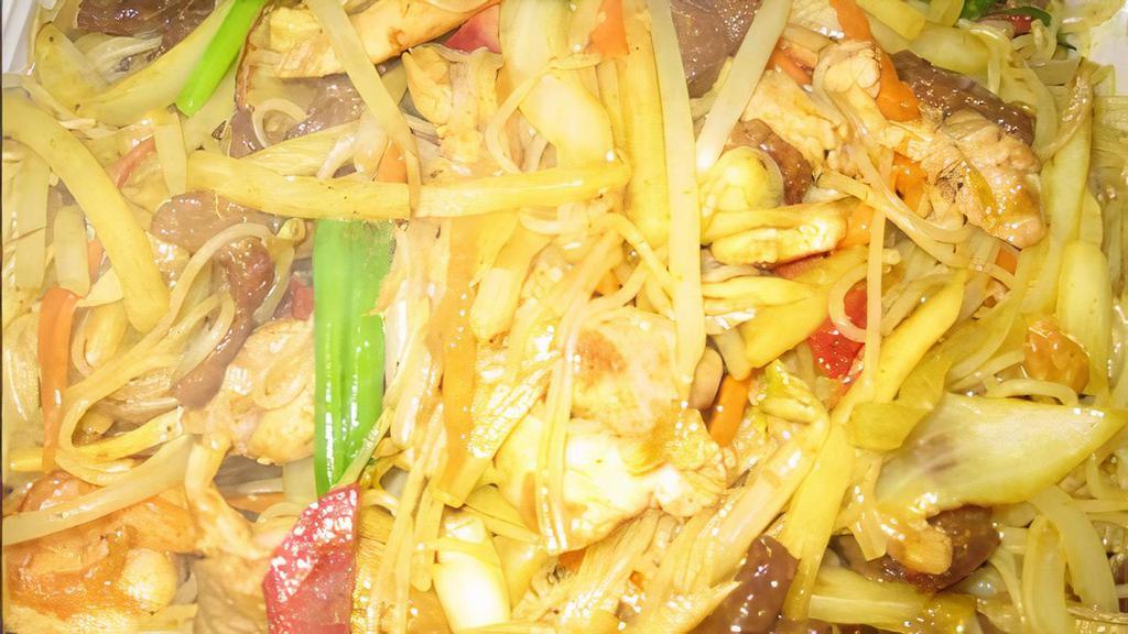 Singapore Chow Rice Noodles · Small rice noodles stir fried with chicken, beef, pork, shrimp and strips of vegetables in curry sauce.