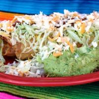 Chimichanga · Topped with lettuce, cheese, sour cream and guacamole.