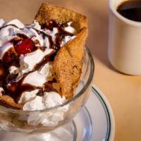 Fried Ice Cream · Vanilla Ice Cream Rolled in Corn Flakes, Deep Fried and Garnished with Whipped Cream and a C...