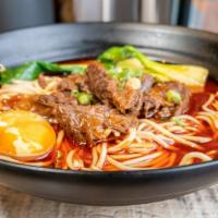 Spicy Braised Beef Noodle Soup · Spicy. Flour noodle, chili sauce, egg, bok choy.