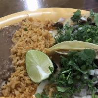 2 Soft Taco Plate · Two tacos. Big corn tortilla. Served with onions and cilantro. Sides of rice and beans. Onio...