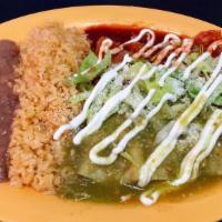 Mixed Enchilada Plate · Three enchiladas - red sauce is not spicy. Green sauce is spicy. Topped with lettuce, sour c...