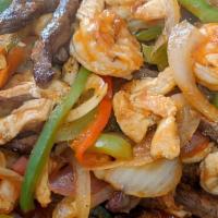 Mix Fajitas Plate · Steak, chicken and shrimp grilled with red and green bell peppers and onions. Served with ri...