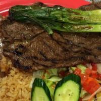 Carne Asada Plate · Served with rice, beans, salad and corn tortillas.
