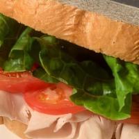 Turkey Breast Sandwich · Oven roasted turkey on a toasted bread with mayo or mustard lettuce, tomato, and choice of C...