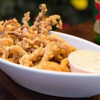 Fried Calamari · Crispy delicious fried Calamari, garnished with herb mix and chipotle sauce on the side.