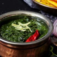 Saag · Finely chopped spinach cooked down with onions, cinnamon, cloves, ginger, chili, garlic, cor...