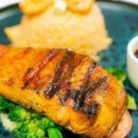 Salmon Teriyaki · Salmon steak grilled to perfection glazed with teriyaki sauce. Served with Broccoli.