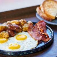 American · Three eggs any style house potatoes, bacon, and choice of bread.