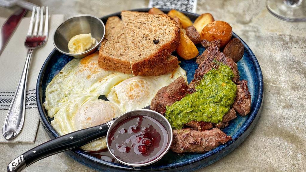 Steak & Eggs · Skirt steak(6 oz), three eggs any style, and preserve lemon gremolata, served with house potatoes and choice of bread.