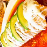 Chiles Rellenos · Served with rice and beans.